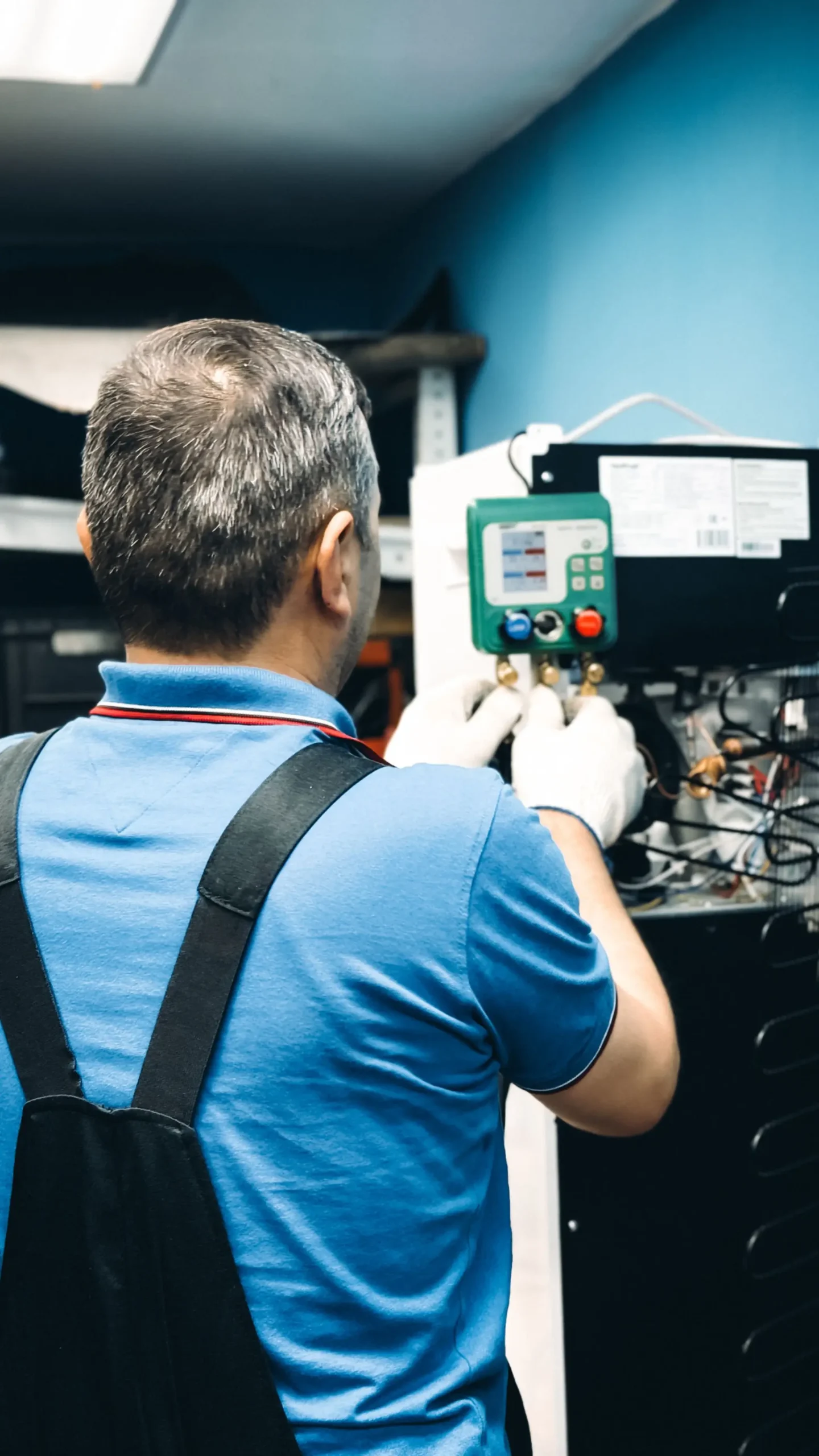 Indoor HVAC equipment being inspected during air conditioning maintenance
